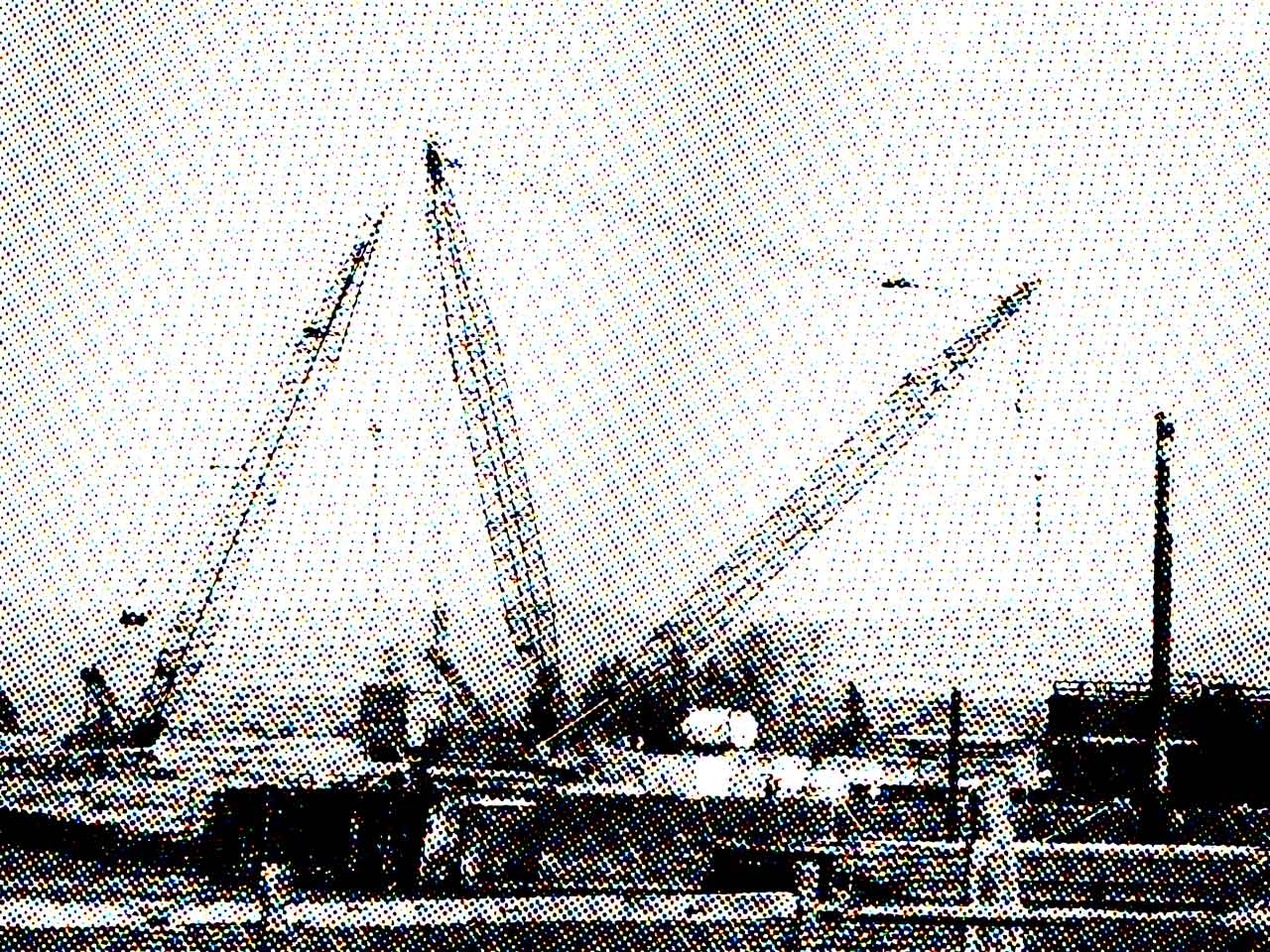 a halftoned construction site, with mechanical cranes in front of a mountain landscape